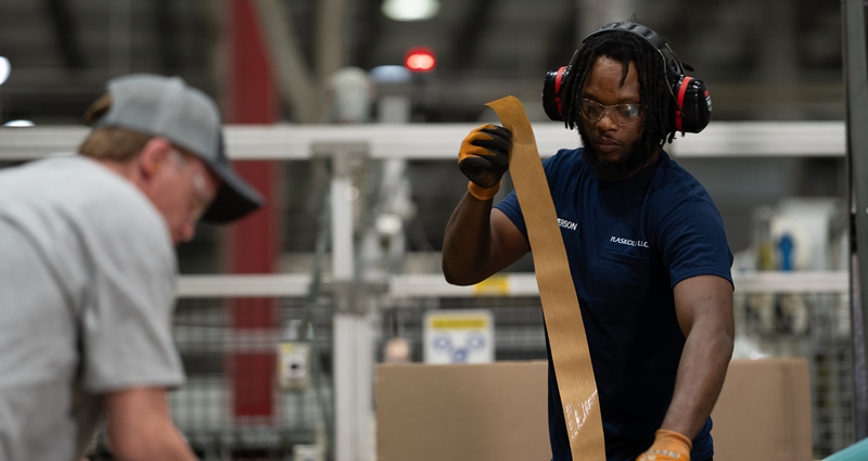 PLASKOLITE employee working