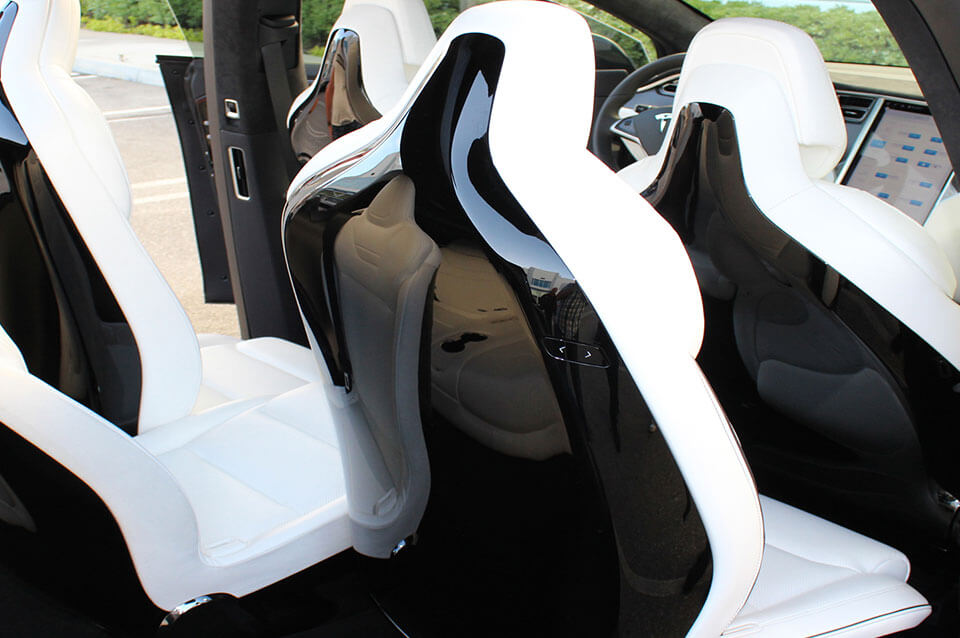 Tesla Model X middle seat backs, showing one of the common thermoplastics in automotive applications
